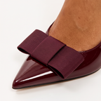 Burgundy patent bow detail