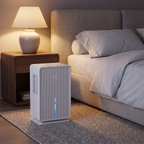 Ribbed compact dehumidifier next to the bed in a calm bedroom
