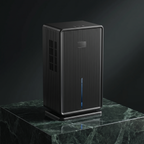 Ribbed compact dehumidifier in black on a green marble plinth